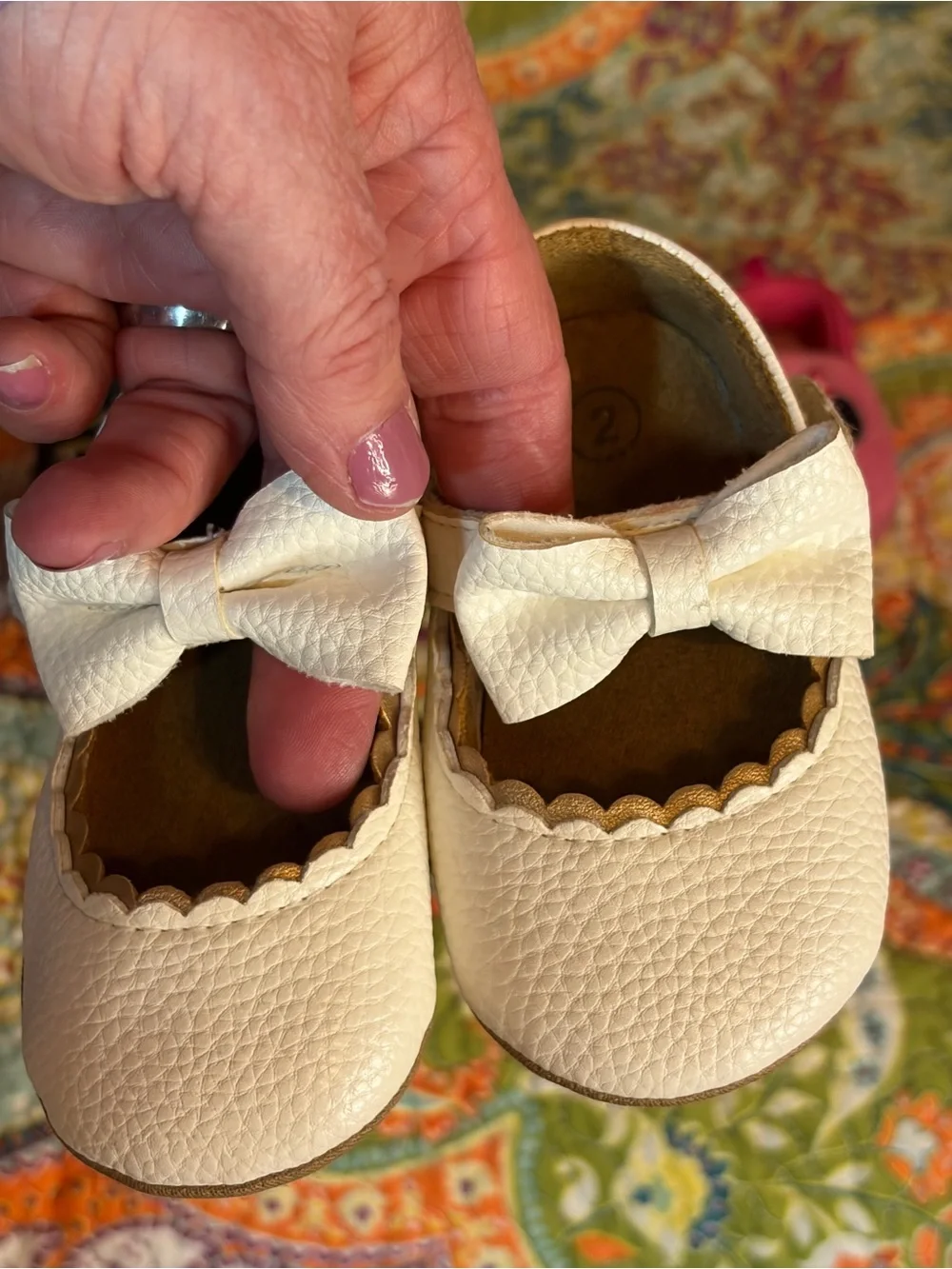 Lot of three pairs of Baby shoes.
